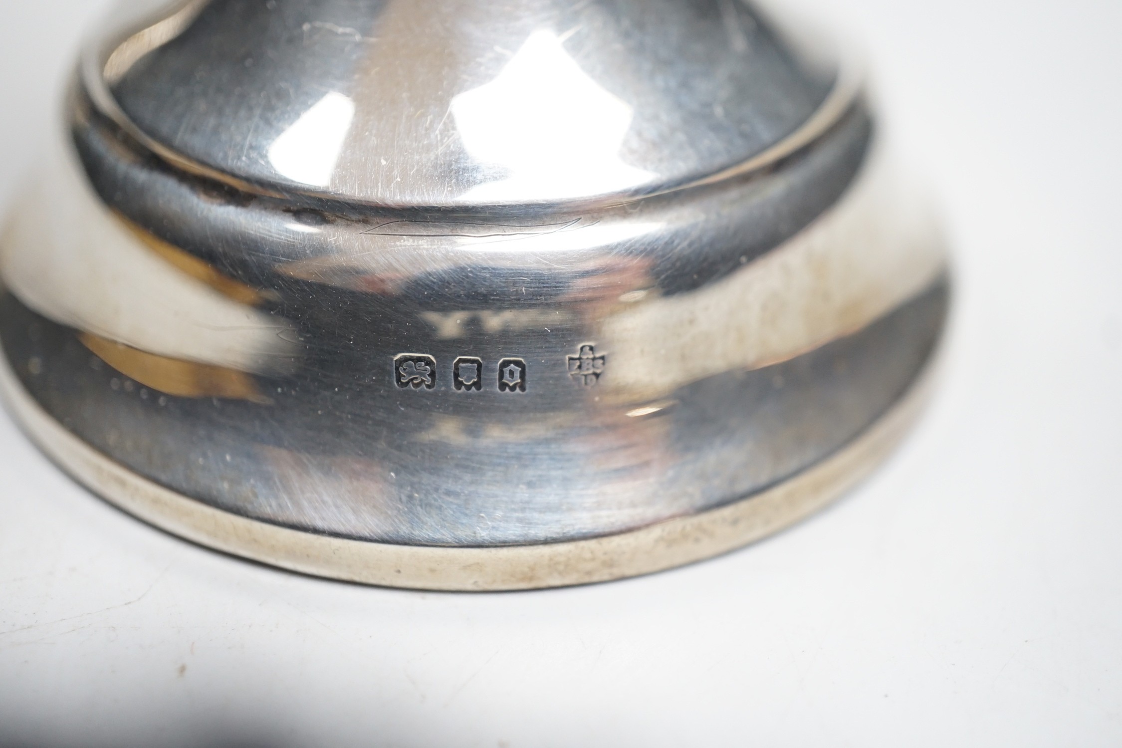 A pair of 1930's silver mounted dwarf candlesticks, 10cm, a silver mounted glass hair tidy and a scent bottle.